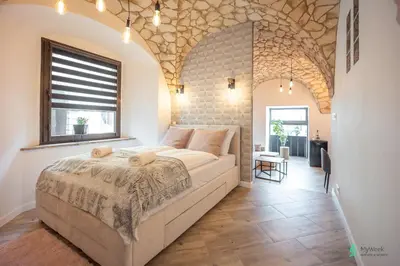 Łóżko lub łóżka w pokoju w obiekcie Apartament Pod Ratuszem I