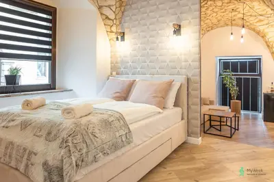 Łóżko lub łóżka w pokoju w obiekcie Apartament Pod Ratuszem I
