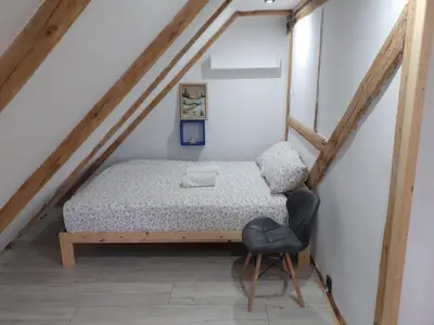 Łóżko lub łóżka w pokoju w obiekcie Agroturystyka Janowa Chata