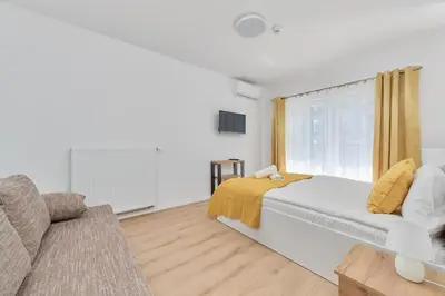 Łóżko lub łóżka w pokoju w obiekcie Modern Elegance Apartments Wrocław with AC by Noclegi Renters