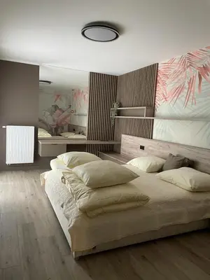 Łóżko lub łóżka w pokoju w obiekcie GOLD Apartment Centrum garaż
