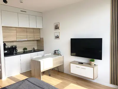 Telewizja i/lub zestaw kina domowego w obiekcie Apartimento Hydral Aria