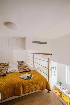 Łóżko lub łóżka w pokoju w obiekcie StarterApart Wrocław