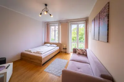 Łóżko lub łóżka w pokoju w obiekcie Magnolia Vision Apartment - Rynek