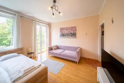 Łóżko lub łóżka w pokoju w obiekcie Magnolia Vision Apartment - Rynek
