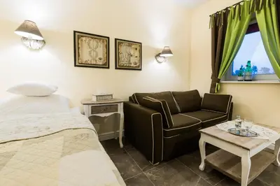 Łóżko lub łóżka w pokoju w obiekcie Villa Aurora