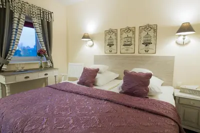 Łóżko lub łóżka w pokoju w obiekcie Villa Aurora