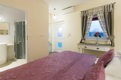 Łóżko lub łóżka w pokoju w obiekcie Villa Aurora