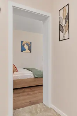 Łóżko lub łóżka w pokoju w obiekcie Comfy Apartment with Parking & Balcony by Noclegi Renters