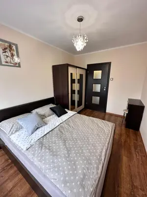 Łóżko lub łóżka w pokoju w obiekcie Apartament Dąbrowskiego - Gliwice