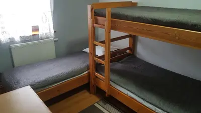 Łóżko lub łóżka w pokoju w obiekcie Ośrodek Wypoczynkowy Regle