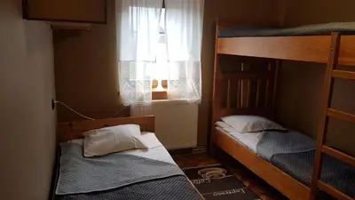 Łóżko lub łóżka w pokoju w obiekcie Ośrodek Wypoczynkowy Regle
