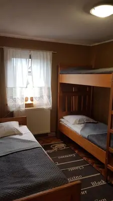 Łóżko lub łóżka w pokoju w obiekcie Ośrodek Wypoczynkowy Regle