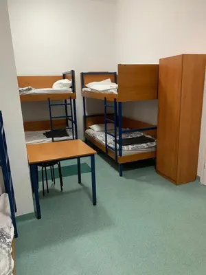 Łóżko lub łóżka w pokoju w obiekcie Schronisko na Wyspie