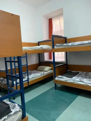 Łóżko lub łóżka w pokoju w obiekcie Schronisko na Wyspie