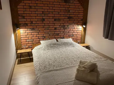 Łóżko lub łóżka w pokoju w obiekcie Apartamenty MOGADOR