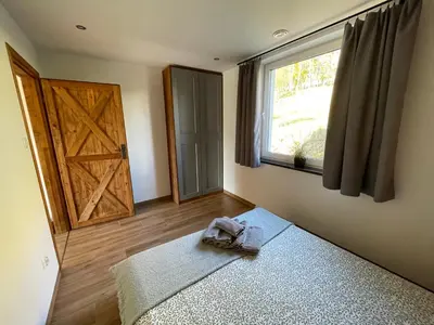Łóżko lub łóżka w pokoju w obiekcie Apartamenty MOGADOR