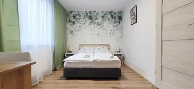 Łóżko lub łóżka w pokoju w obiekcie Zielona Noc