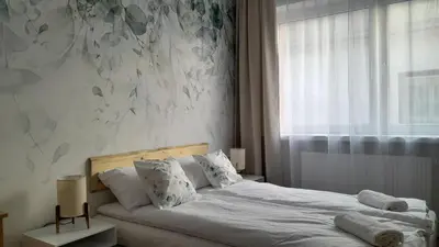 Łóżko lub łóżka w pokoju w obiekcie Zielona Noc