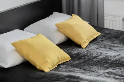 Łóżko lub łóżka w pokoju w obiekcie Apartament Studzienna Wrocław by Noclegi Renters