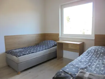 Łóżko lub łóżka w pokoju w obiekcie Apartamenty pod Jagodną