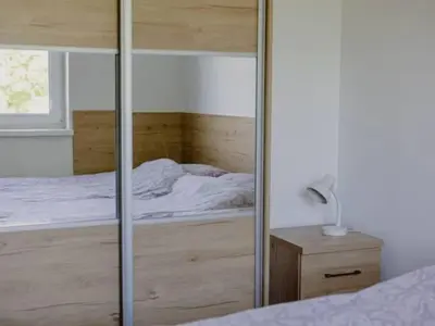 Łóżko lub łóżka w pokoju w obiekcie Apartamenty pod Jagodną