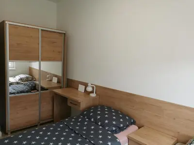Łóżko lub łóżka w pokoju w obiekcie Apartamenty pod Jagodną
