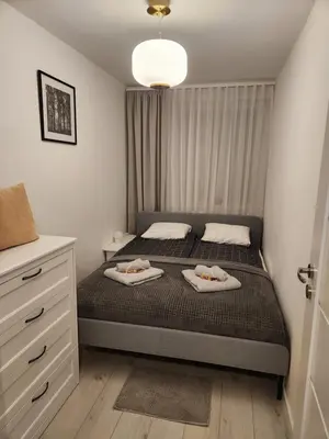 Łóżko lub łóżka w pokoju w obiekcie Moon Apartment