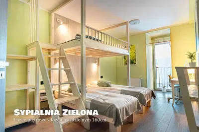 Łóżko lub łóżka w pokoju w obiekcie Apartament Fotografa