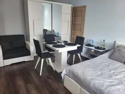 Łóżko lub łóżka w pokoju w obiekcie Apartament Ares