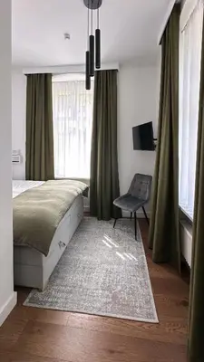 Łóżko lub łóżka w pokoju w obiekcie Apartament Miła 2 Lądek-Zdrój