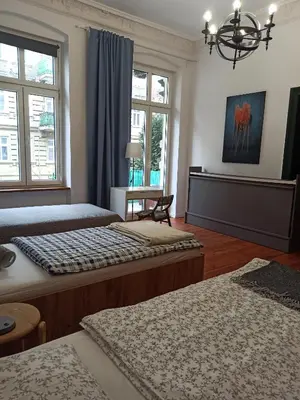 Łóżko lub łóżka w pokoju w obiekcie Apartament PAPROTKA 100m