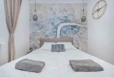 Łóżko lub łóżka w pokoju w obiekcie Apartament Berbeckiego