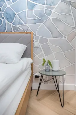 Łóżko lub łóżka w pokoju w obiekcie Apartament Berbeckiego