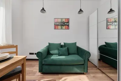 Część wypoczynkowa w obiekcie Norwida Apartment with Balcony Downtown Wrocław by Noclegi Renters