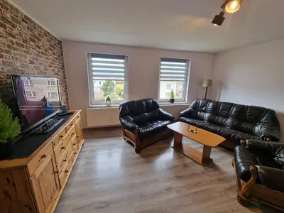 Część wypoczynkowa w obiekcie Przestronny apartament +siłownia