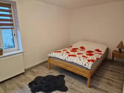 Łóżko lub łóżka w pokoju w obiekcie Przestronny apartament +siłownia