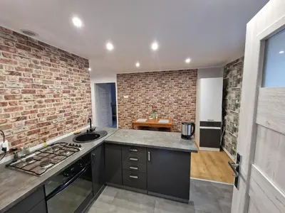 Kuchnia lub aneks kuchenny w obiekcie Przestronny apartament +siłownia