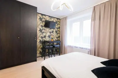 Łóżko lub łóżka w pokoju w obiekcie Monjan II Luxury Square Market Rynek