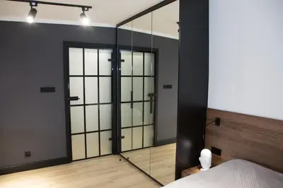 Łóżko lub łóżka w pokoju w obiekcie Apartament NEPTUN Centrum