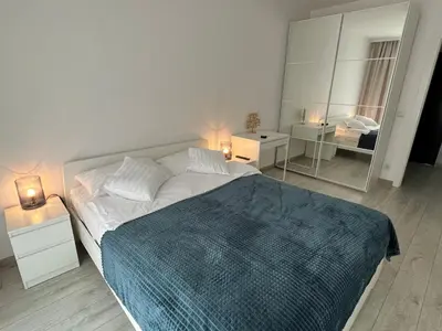 Łóżko lub łóżka w pokoju w obiekcie I&M Apartments Sikorskiego Wrocław