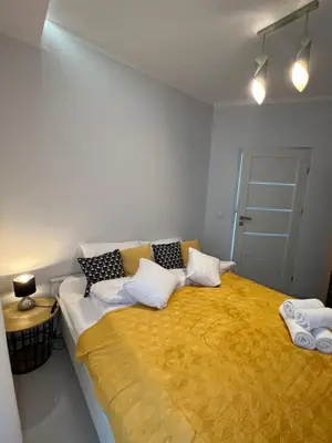Łóżko lub łóżka w pokoju w obiekcie I&M Apartments Sikorskiego Wrocław