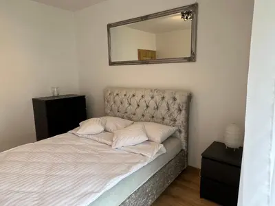 Łóżko lub łóżka w pokoju w obiekcie I&M Apartments Sikorskiego Wrocław