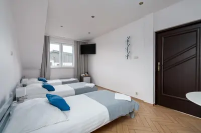 Łóżko lub łóżka w pokoju w obiekcie Sleeply Pensjonat Złotniki- dom dla 18 osób