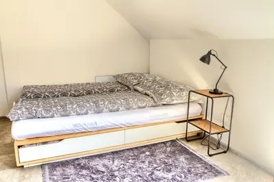 Łóżko lub łóżka w pokoju w obiekcie Gray Wings Home
