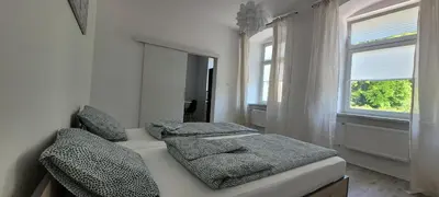 Łóżko lub łóżka w pokoju w obiekcie Apartament CityStation
