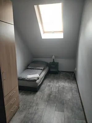 Łóżko lub łóżka w pokoju w obiekcie Przystanek Rozkochów