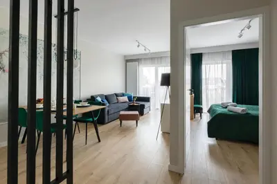 Łóżko lub łóżka w pokoju w obiekcie Apartament Radosny