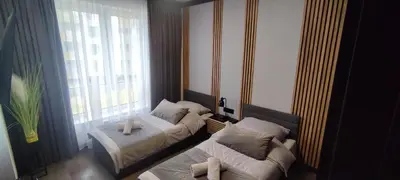 Łóżko lub łóżka w pokoju w obiekcie Belweder LOFT