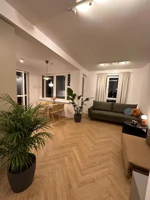 Część wypoczynkowa w obiekcie Apartament na Letniej z dużym tarasem z widokiem na góry